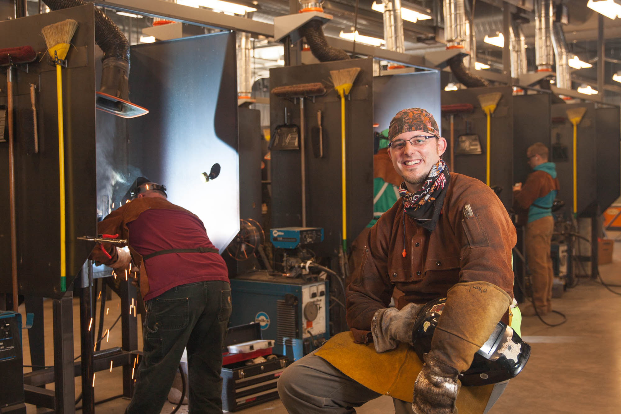 Welding student in welding shop