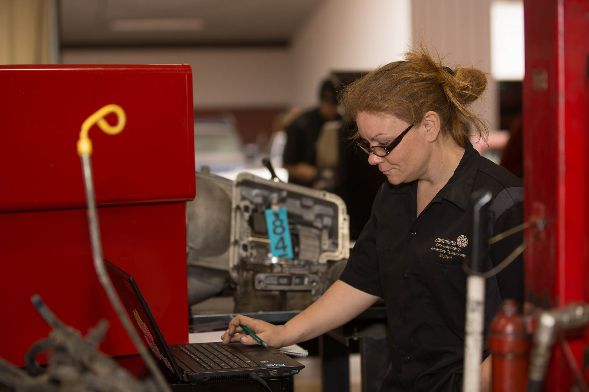 Woman working as an auto tech